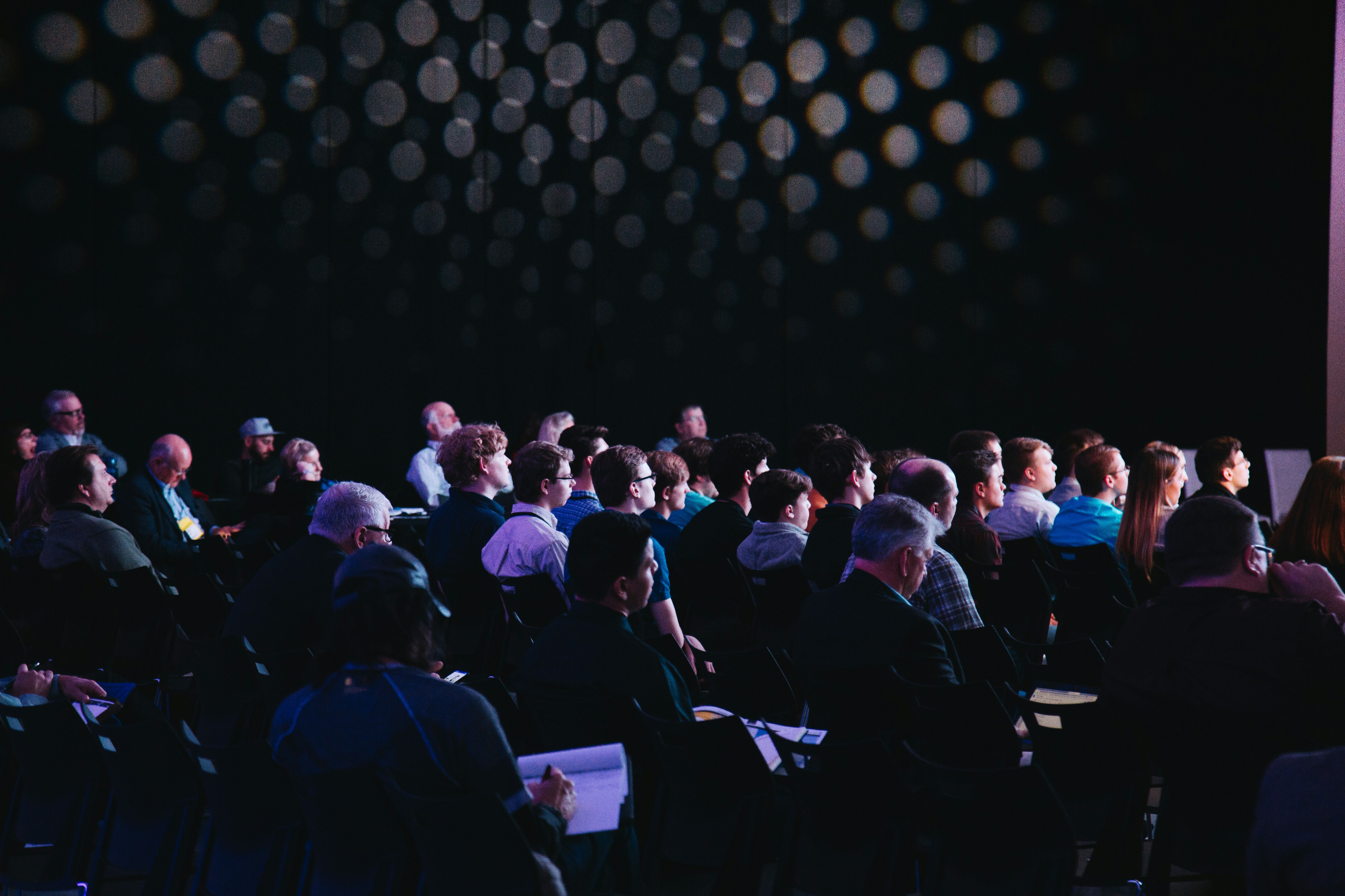 People collaborating at a technology event